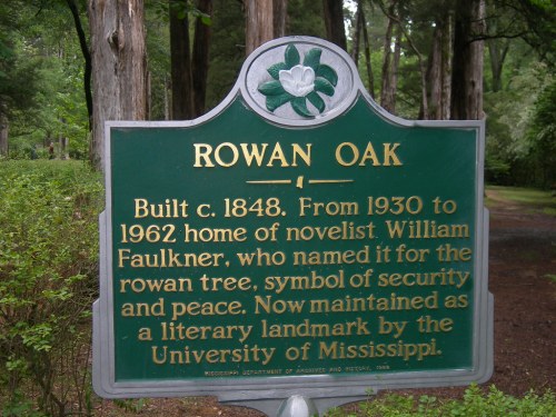 Sign for Rowan Oak, home of novelist William Faulkner, highlighting its historical significance and literary importance.