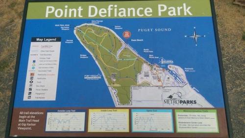 Map of Point Defiance Park, showing trails, viewpoints, and nearby attractions in Puget Sound area.