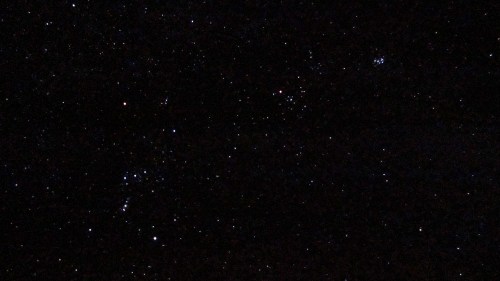 A starry night sky filled with numerous stars and constellations against a dark background.