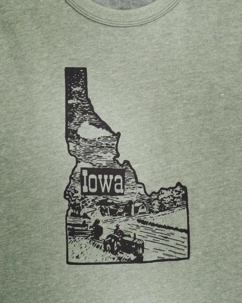 Graphic of Iowa's outline on a green shirt, featuring a vintage tractor and landscape design.