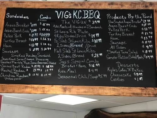 Menu board featuring BBQ sandwiches, combo options, products by the pound, and desserts with prices listed.