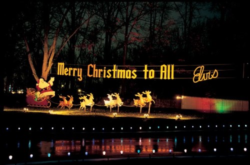A festive display featuring "Merry Christmas to All" in lights, with Santa and reindeer in a nighttime setting.