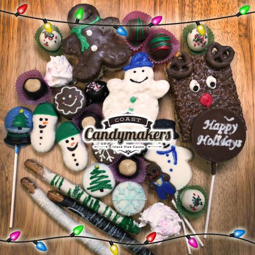 A festive assortment of holiday-themed candies and treats, including snowmen, reindeer, and chocolate-covered sweets.