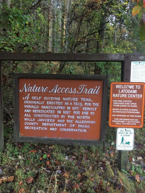 Sign for the Nature Access Trail, highlighting its history and accessibility for the visually handicapped.