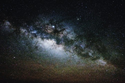 A stunning view of the Milky Way galaxy filled with stars and cosmic dust against a dark night sky.