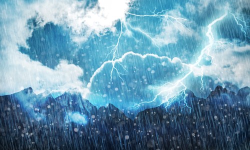 A dramatic storm scene with dark clouds, heavy rain, and lightning striking over a mountain landscape.