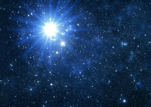A bright star shines in a dark, star-filled galaxy, surrounded by twinkling celestial bodies and cosmic dust.