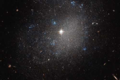A stunning view of a star-filled galaxy, featuring bright stars and clusters of blue and white celestial bodies.