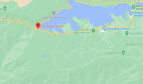 Map showing the location of Dam Keepers House near a lake, with nearby landmarks and roads highlighted.