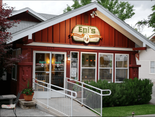 A red and white restaurant exterior with a sign reading "Epi's: A Basque Restaurant" and a ramp leading to the entrance.