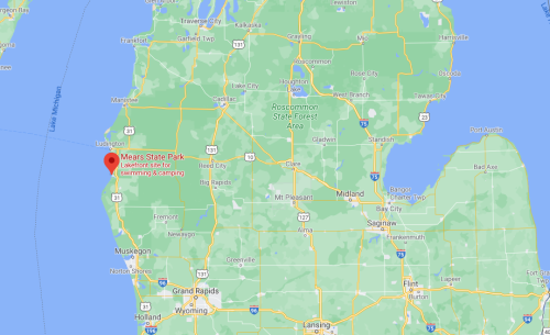 Map showing Mears State Park in Michigan, highlighting areas for swimming and camping near Lake Michigan.