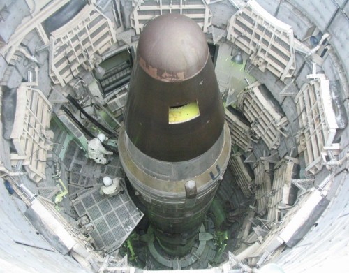 Aerial view of a missile inside a launch silo, showcasing the cylindrical structure and surrounding support framework.