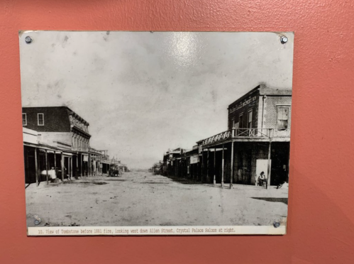 Black and white photo of Tombstone, Arizona, before the 1881 fire, showing Allen Street and Crystal Palace Saloon.