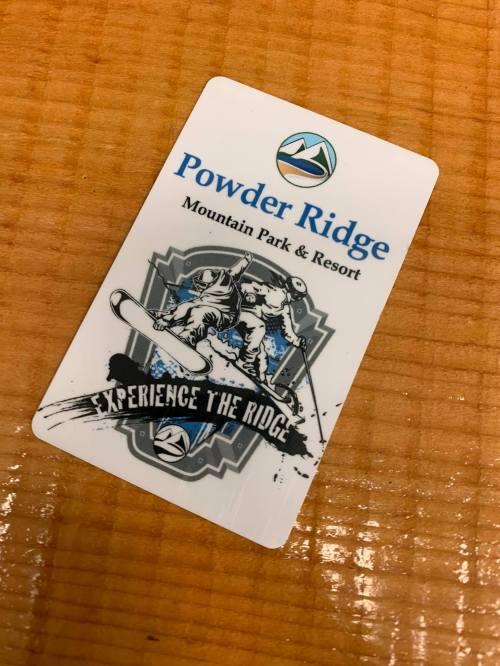 A card for Powder Ridge Mountain Park & Resort featuring a snowboard graphic and the text "Experience the Ridge."