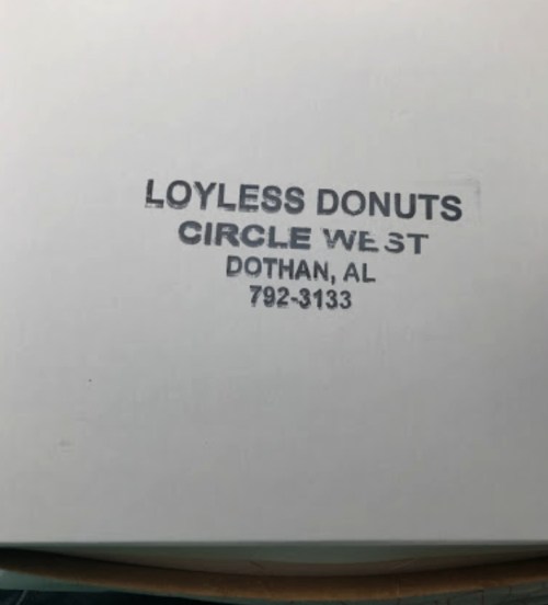Label on a box reading "LOYLESS DONUTS, CIRCLE WEST, DOTHAN, AL, 792-3133."