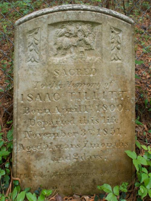 Weathered gravestone inscribed with "Sacred to the memory of Isaac Tilliit, born April 1800, died November 3, 1851."