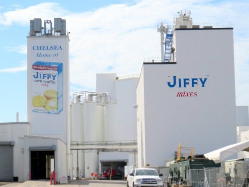 Exterior of the Jiffy factory in Chelsea, featuring large signs for Jiffy corn muffin mix and mixes.