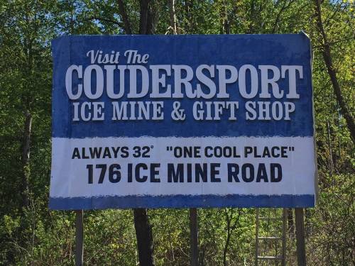 Sign for Coudersport Ice Mine & Gift Shop, featuring "Always 32°" and location details on Ice Mine Road.