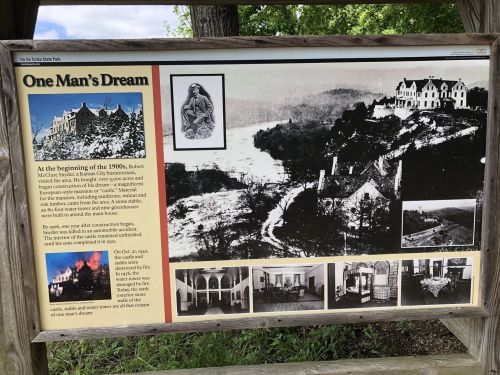 Signboard titled "One Man's Dream" featuring historical images and text about Robert McCulloch and his vision for a state park.