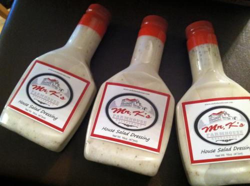 Three bottles of Mr. K's House Salad Dressing, each with a red cap and a label featuring the brand name and product details.