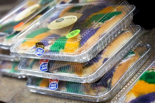 Colorful layered pastries stacked in clear containers, labeled with "Cream Cheese" and "Paul's Pastry Shop, LLC."