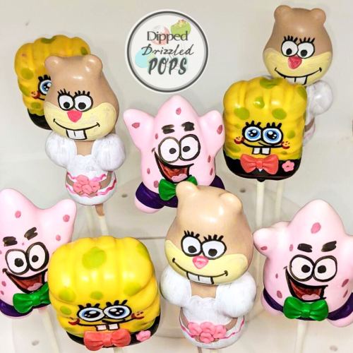 Colorful cake pops shaped like cartoon characters, including SpongeBob, Patrick, and Sandy, displayed on sticks.