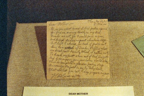 A handwritten letter on aged paper addressed to "Dear Mother," expressing feelings and reflections.