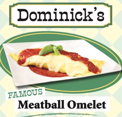 A delicious meatball omelet topped with marinara sauce and cheese, served on a white plate.