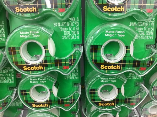 Two rolls of Scotch matte finish magic tape in green packaging, stacked on a shelf.