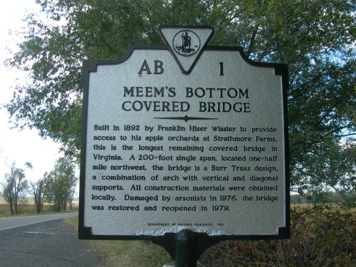Sign for Meem's Bottom Covered Bridge, built in 1892, detailing its history and restoration in 1979.