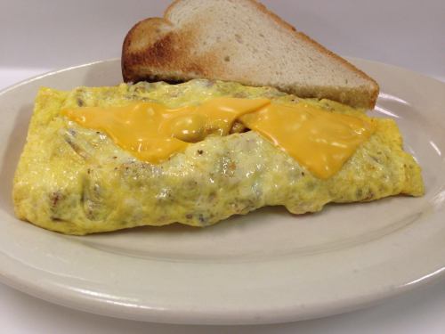 A plate with a cheesy omelet and a slice of toasted bread.