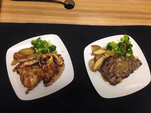 Two plates of food: one with grilled chicken, potatoes, and broccoli; the other with steak, potatoes, and mixed vegetables.