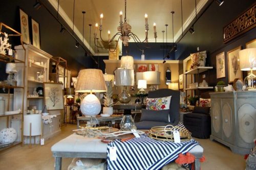 A stylish home decor store featuring various lamps, furniture, and decorative items in a well-lit, inviting space.