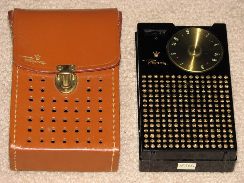 A vintage Regency transistor radio with a leather case, featuring a gold dial and perforated design.