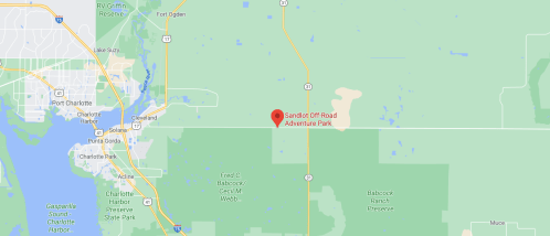 Map showing the location of Sandlot Off-Road Adventure Park in Florida, near Port Charlotte and surrounding green areas.