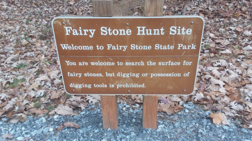 Sign at Fairy Stone State Park welcoming visitors and outlining rules for searching for fairy stones. Digging is prohibited.