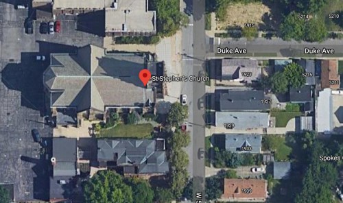 Aerial view of St. Stephen's Church surrounded by residential streets and houses.
