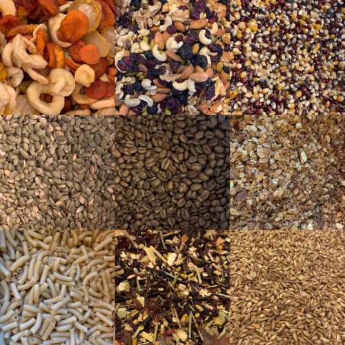 A collage of various seeds, nuts, dried fruits, and grains arranged in a grid pattern.