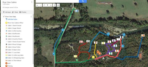 Map of River View Cabins showing cabin locations and the nearby Ouachita River. Color-coded paths indicate routes.