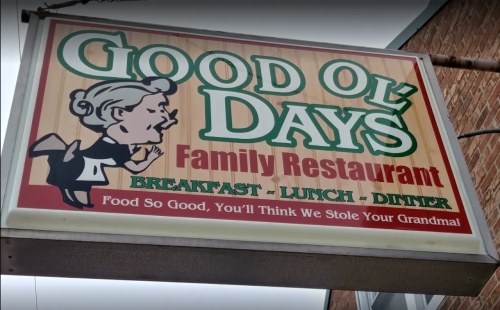 Sign for "Good Ol' Days Family Restaurant" featuring a cartoon woman and the tagline: "Food so good, you'll think we stole your grandma!"