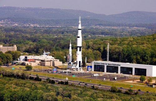 Aerial view of the Davidson Center for Space Exploration, featuring rockets and lush green surroundings.