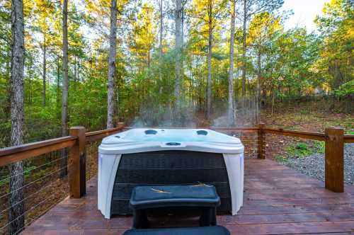 A hot tub on a wooden deck surrounded by trees, with steam rising in a serene outdoor setting.