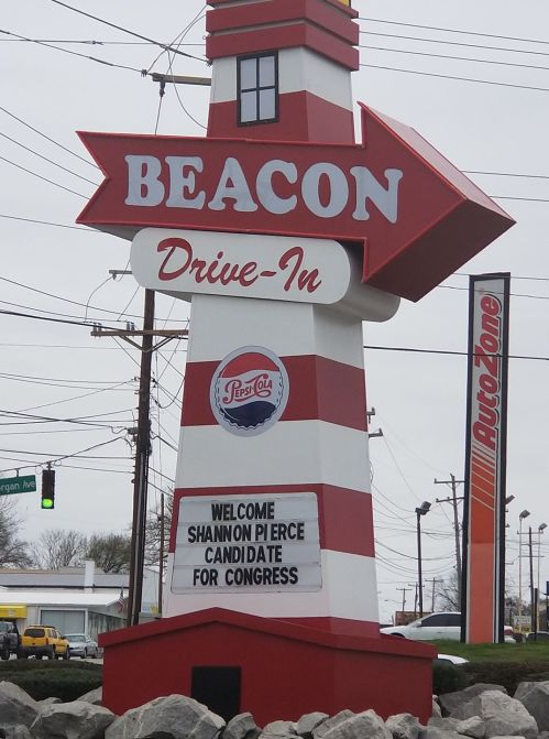 Sign for Beacon Drive-In featuring a red and white lighthouse design, welcoming Shannon Pierce for Congress.