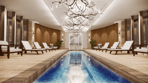 A serene spa interior featuring a pool, lounge chairs, and elegant lighting, creating a relaxing atmosphere.