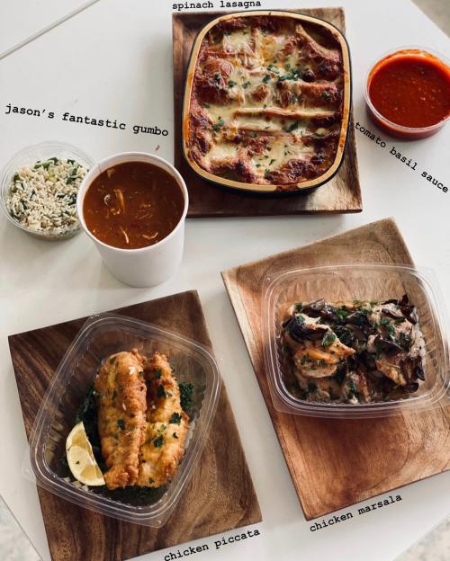 A table with three dishes: spinach lasagna, chicken piccata, and chicken marsala, plus gumbo and tomato basil sauce.