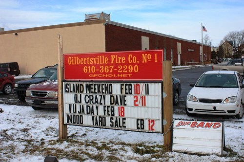 Sign outside Gilbertsville Fire Co. No. 1 listing events: Island Weekend, OJ Crazy Dave, Yuja Day, and a yard sale.