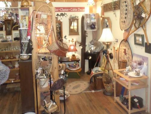 A cozy antique shop filled with various vintage items, including furniture, decor, and unique collectibles.