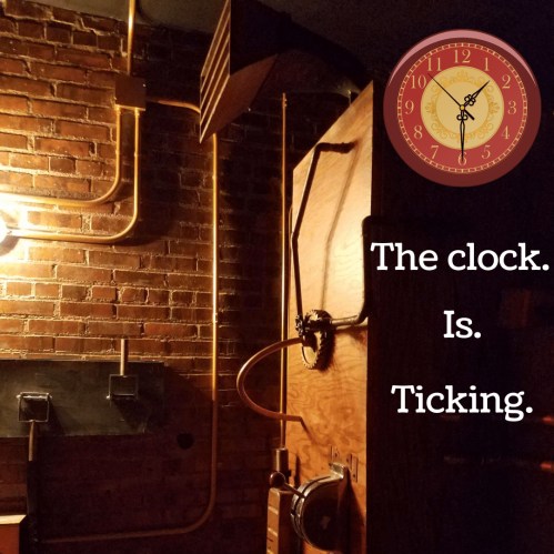 A dimly lit room with exposed pipes and a clock, featuring the text: "The clock. Is. Ticking."