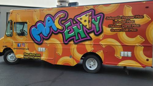 Colorful food truck featuring "Mac Envy" logo and menu items like Jalapeño Popper Mac and Lobster Mac.