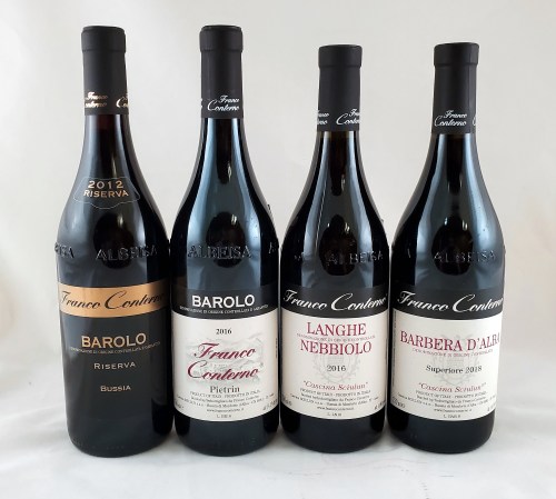 Four bottles of wine with labels: Barolo Riserva 2012, Barolo 2016, Langhe Nebbiolo 2016, and Barbera d'Alba 2015.